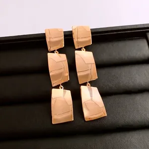18k gold plated square tassel drop earrings with mirror polished finish on black box