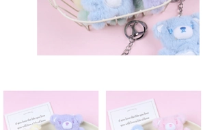 Detailed view of colorful plush bear keychains in soft pastel blue pink and yellow colors