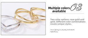 Detail of V-shaped wishbone rings set in gold and rose gold with pavé cubic zirconia