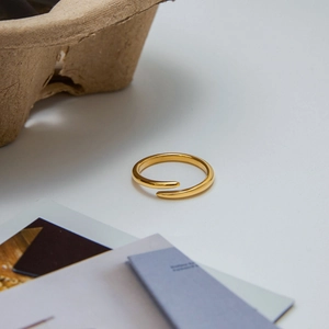 Minimalist gold-plated stainless steel open ring with a streamlined wrap-around design