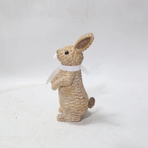 Close-up of Easter bunny ornament with woven resin texture and white ribbon bow