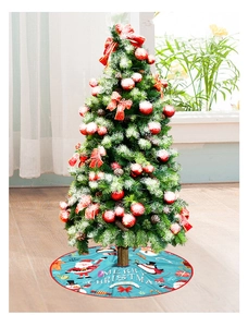 Close-up of blue Christmas tree skirt with Merry Christmas prints and cartoon motifs