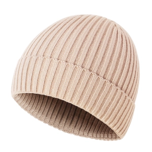 Detail of baby knitted beanie showing soft ribbed texture and folded brim in beige color