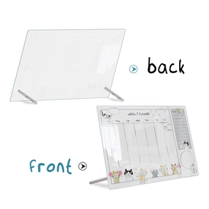 Detail view of the clear acrylic weekly planner with cat graphics and sturdy metal stands