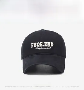 Front detail of black cotton baseball cap with white 3D letter embroidery and wide brim