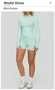 Détail d'un ensemble de yoga vert menthe sans couture avec veste zippée et short côtelé