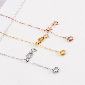 Three-color stainless steel heart necklace set with adjustable slider beads in macro view
