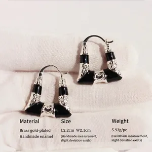 Trapezoidal geometric black enamel earrings with vintage texture and gold-plated brass
