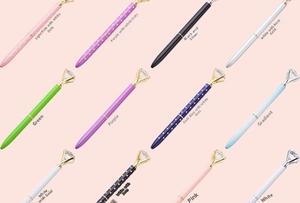 Detailed array of assorted metal diamond pens with crystal tops in various patterns