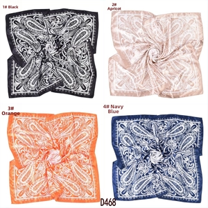 Collage of square satin scarves in four colors featuring classic paisley print patterns