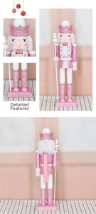 Detail view of pink glitter nutcracker with rhinestone crown and scepter ornaments