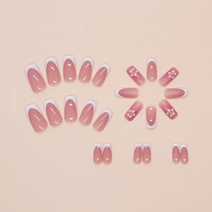 Pink gradient French press-on nails set with tropical hibiscus floral designs and glossy finish