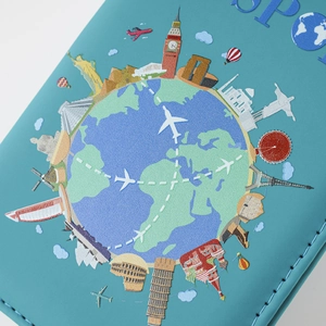 Macro detail of passport cover showing global landmarks print and stitched edges