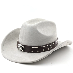 Detail of grey suede cowboy hat featuring leather band with silver skull and stud ornaments