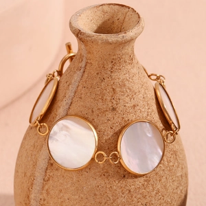 Detailed view of 18K gold plated bracelet with natural shell inlay and classic OT buckle