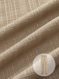 Detail of khaki waffle knit joggers showing breathable fabric texture and drawstring waist