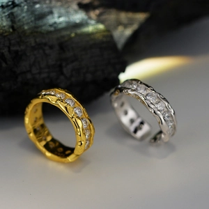 Textured S925 sterling silver ring with cubic zirconia on black charcoal background