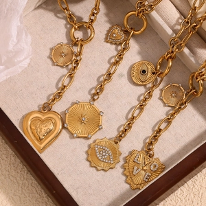 Chic 18K gold plated O-chain necklaces with heart and evil eye pendants in a jewelry box
