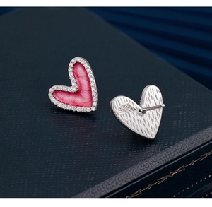 Detail view of the S925 hallmark on silver pink enamel heart stud earrings