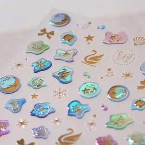 3D holographic gold foil nail stickers with swan, butterfly, and crescent moon designs