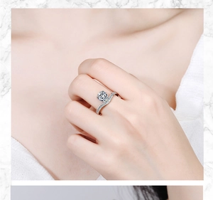 Close-up of elegant S-shaped silver ring with sparkling zircon stones on model hand