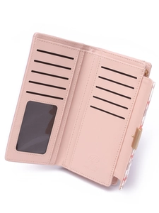 Interior detail of pink PU leather wallet with multiple card slots and clear ID window