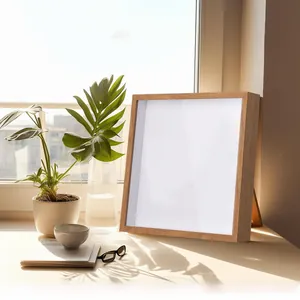 Close-up of square wooden ticket shadow box on a sunlit window sill with plants