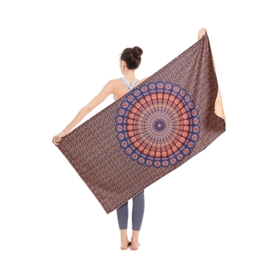 Absorbent microfiber beach towel with exotic red and blue mandala patterns for yoga