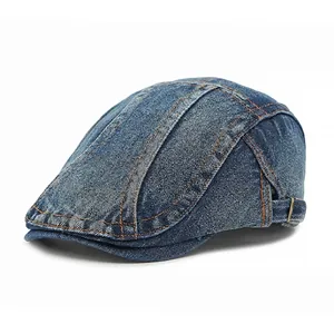 Vintage dark blue denim beret with orange contrast stitching and adjustable metal buckle