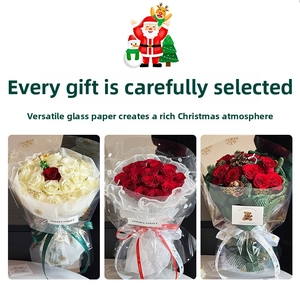 Detail of Christmas rose bouquets wrapped in snowflake pattern transparent cellophane
