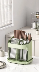 Detail of kitchen utensil holder with multiple compartments for knives and forks