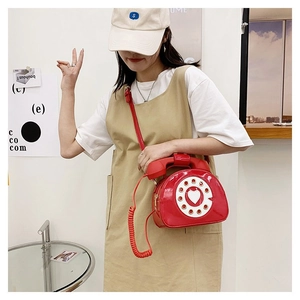 Creative red retro telephone crossbody bag in patent leather with dial detail