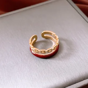 Double-layered gold chain ring with red enamel finish and adjustable open design