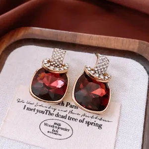 Vintage style square red crystal earrings with gold plating and sparkling rhinestones