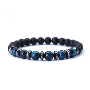 Detail of blue tiger eye and matte black onyx beads bracelet with silver spacers