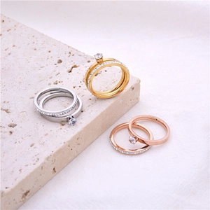 Three sets of roman numeral rings in gold, silver, and rose gold with zircon stones