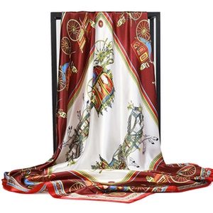 Detailed close-up showing the smooth silk texture and equestrian horse print of this scarf