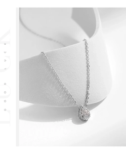 Close-up of S925 sterling silver pear-shaped pendant with pavé cubic zirconia