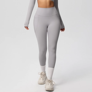 Detail view of high-waisted yoga leggings with side pockets and slimming tummy control