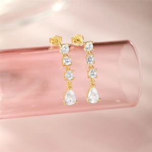 Macro shot of S925 silver teardrop earrings with sparkling white cubic zirconia stones