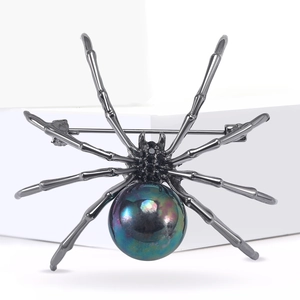 Creative spider brooch with large iridescent pearl and black rhinestones in gunmetal finish