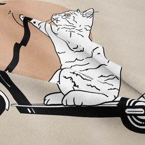 Detailed view of bohemian tapestry fabric showing woven texture and cute cat illustration