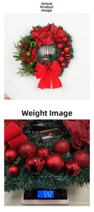 Christmas wreath with red poinsettia flowers and vintage oil lamp hanging decoration