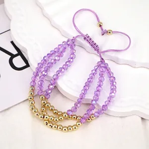 Detailed macro of triple-layer purple crystal beads with adjustable woven strap cord