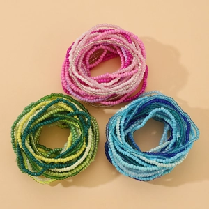 Detailed top view of handmade colorful bohemian beaded stretch bracelet and necklace sets
