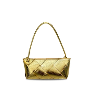 Detail of gold woven leather texture and knotted handle on this chic crossbody bag