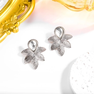 Detailed close-up of fan-shaped sunflower stud earrings with sparkling silver crystals