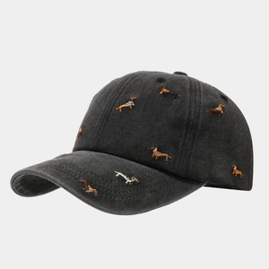 Close-up of colorful dachshund embroidery on dark gray washed cotton baseball cap