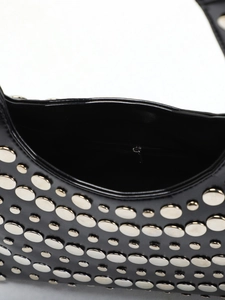 Detail view of the punk rivet shoulder bag interior with high-quality zipper pocket