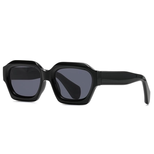 Retro polygon thick frame black sunglasses with dark gray lenses in a studio shot